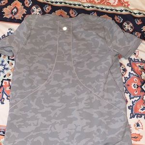A short sleeve Camo grey lulu lemon shirt.